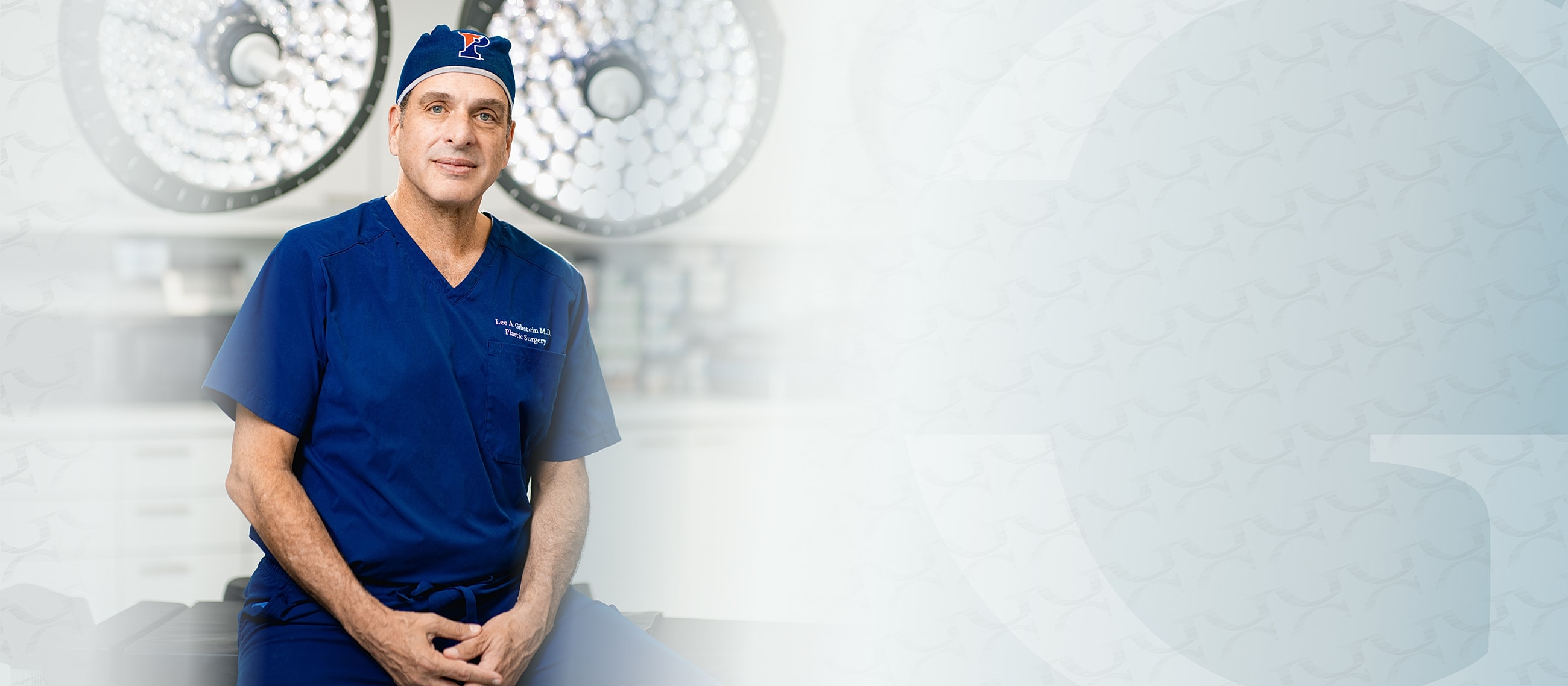 Surgeon in operating room wearing blue scrubs