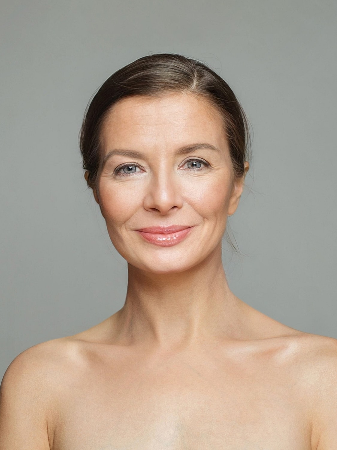 Smiling woman with natural makeup and glowing skin
