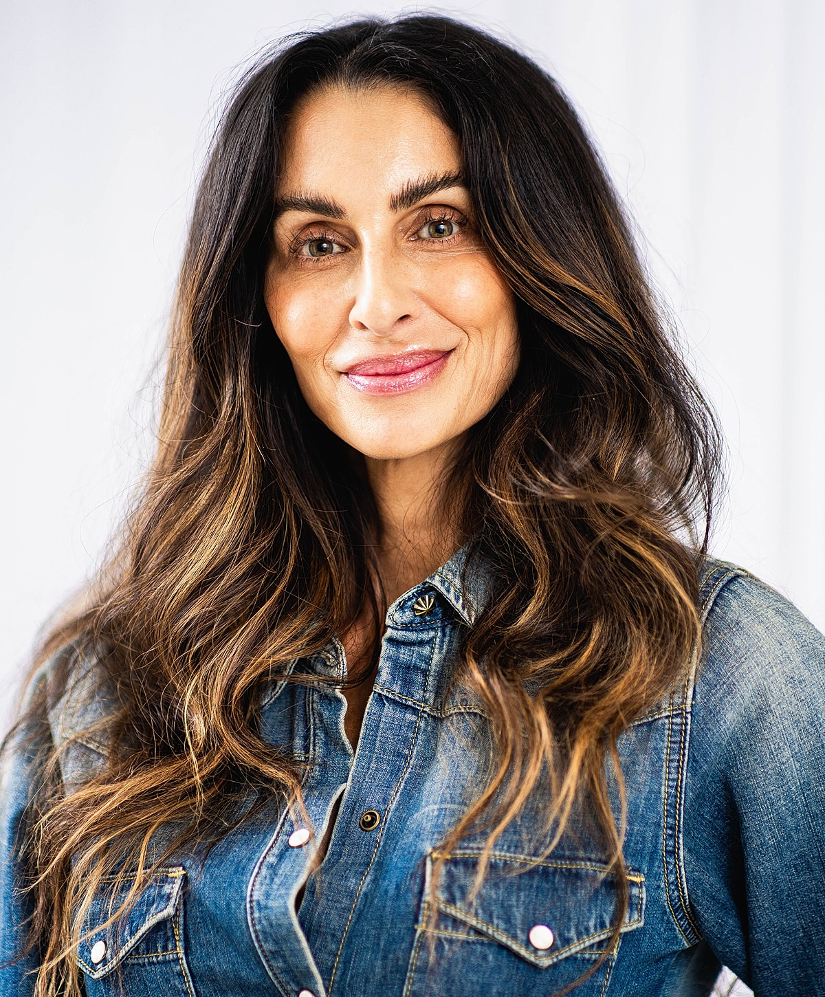 Woman with long hair in denim shirt