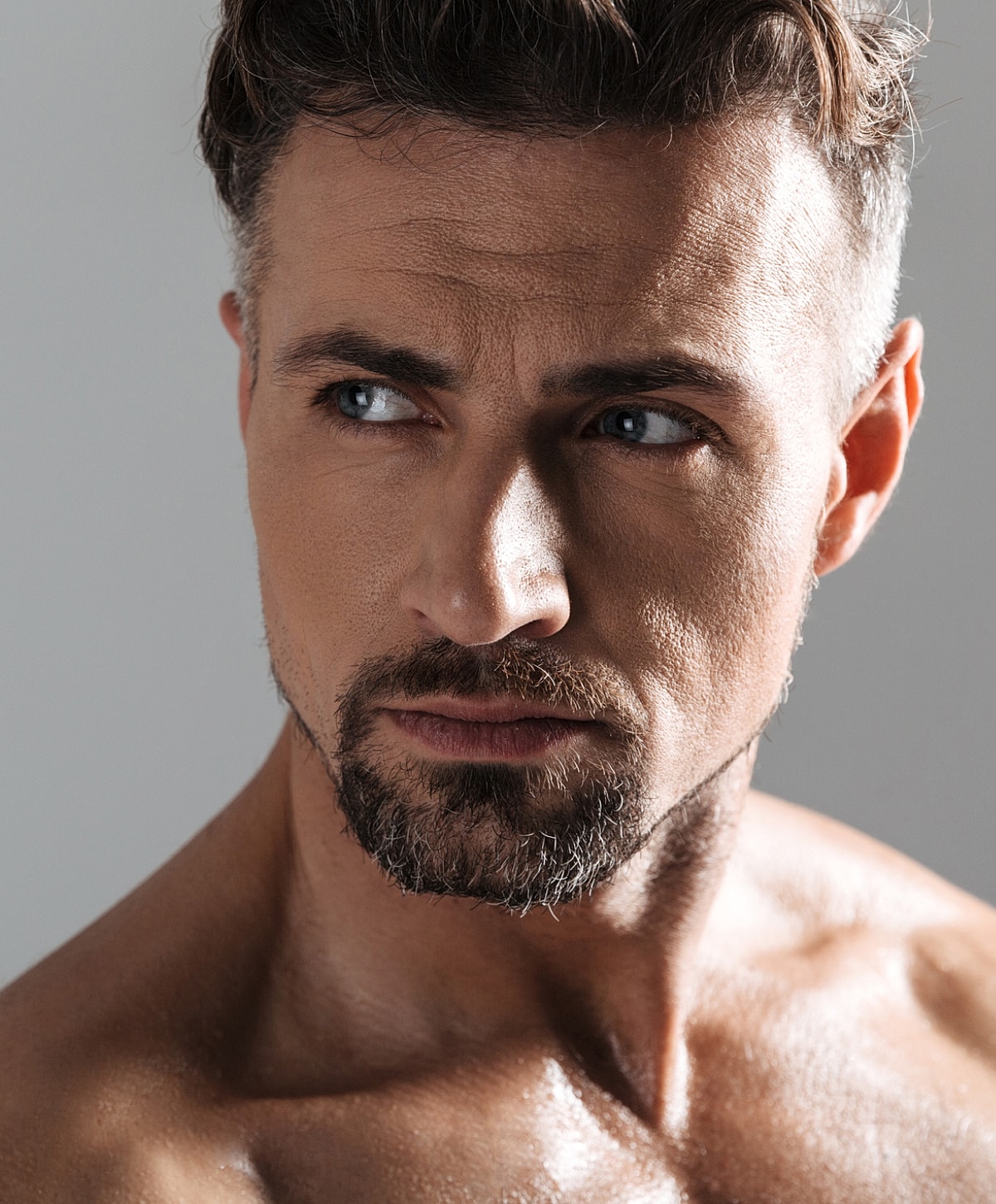 Close-up of a handsome man with stubble.
