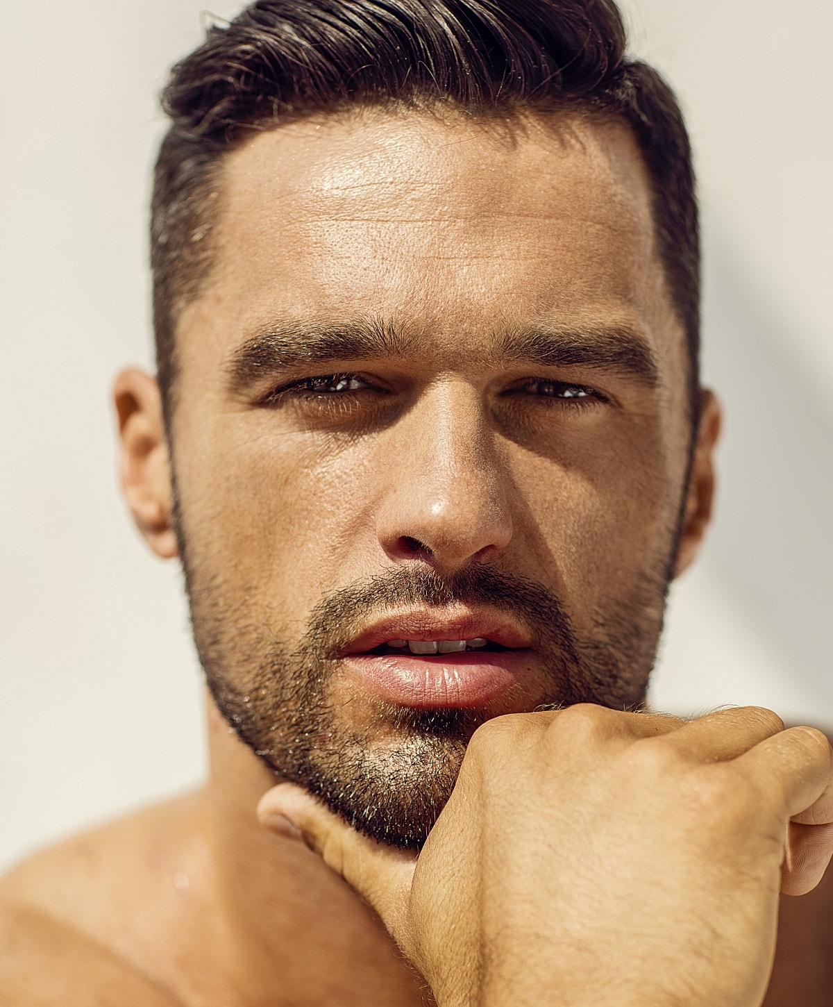 Close-up of a man with a thoughtful expression.