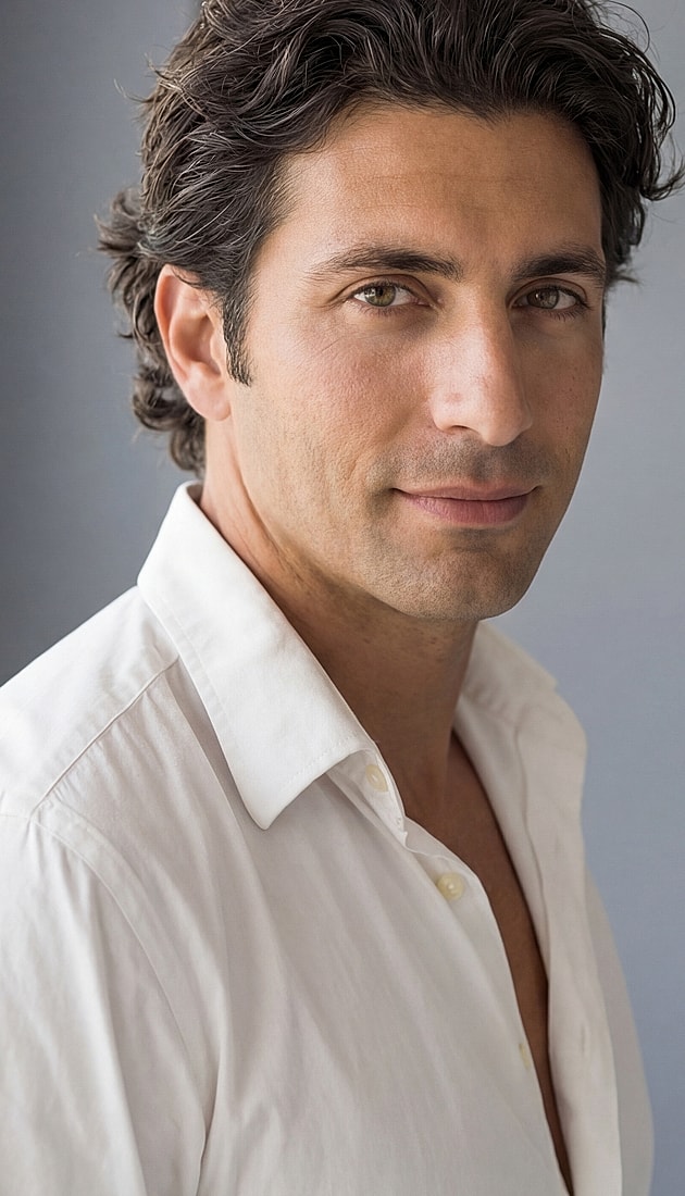 Portrait of a man in a white shirt.