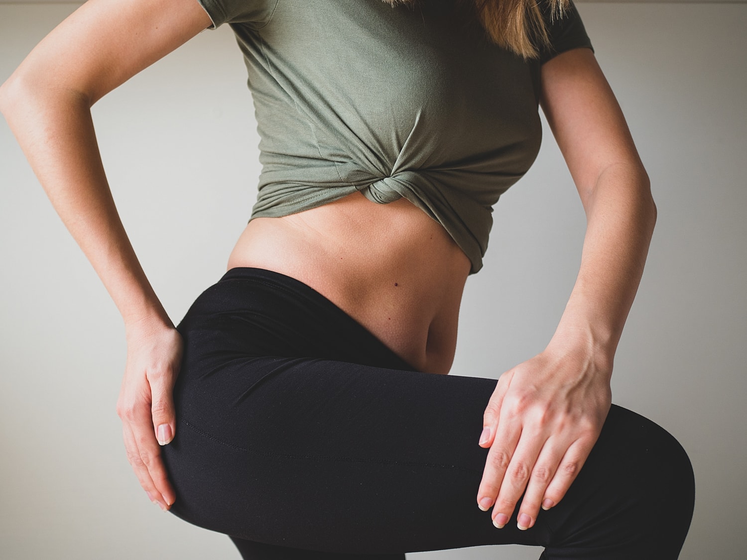 Person in athletic clothing striking a pose.