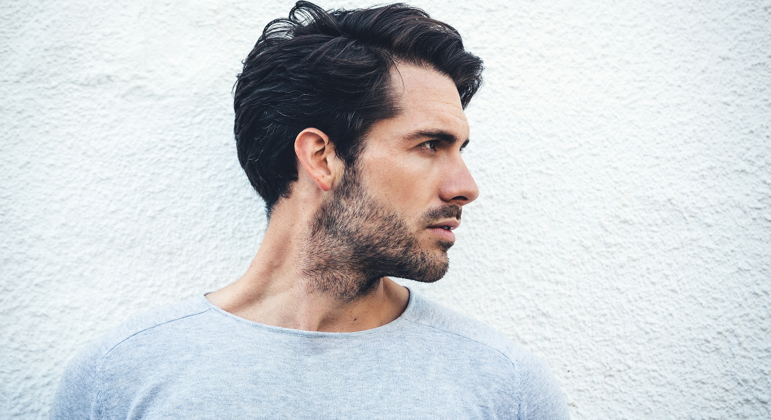 Profile of a man with styled hair.
