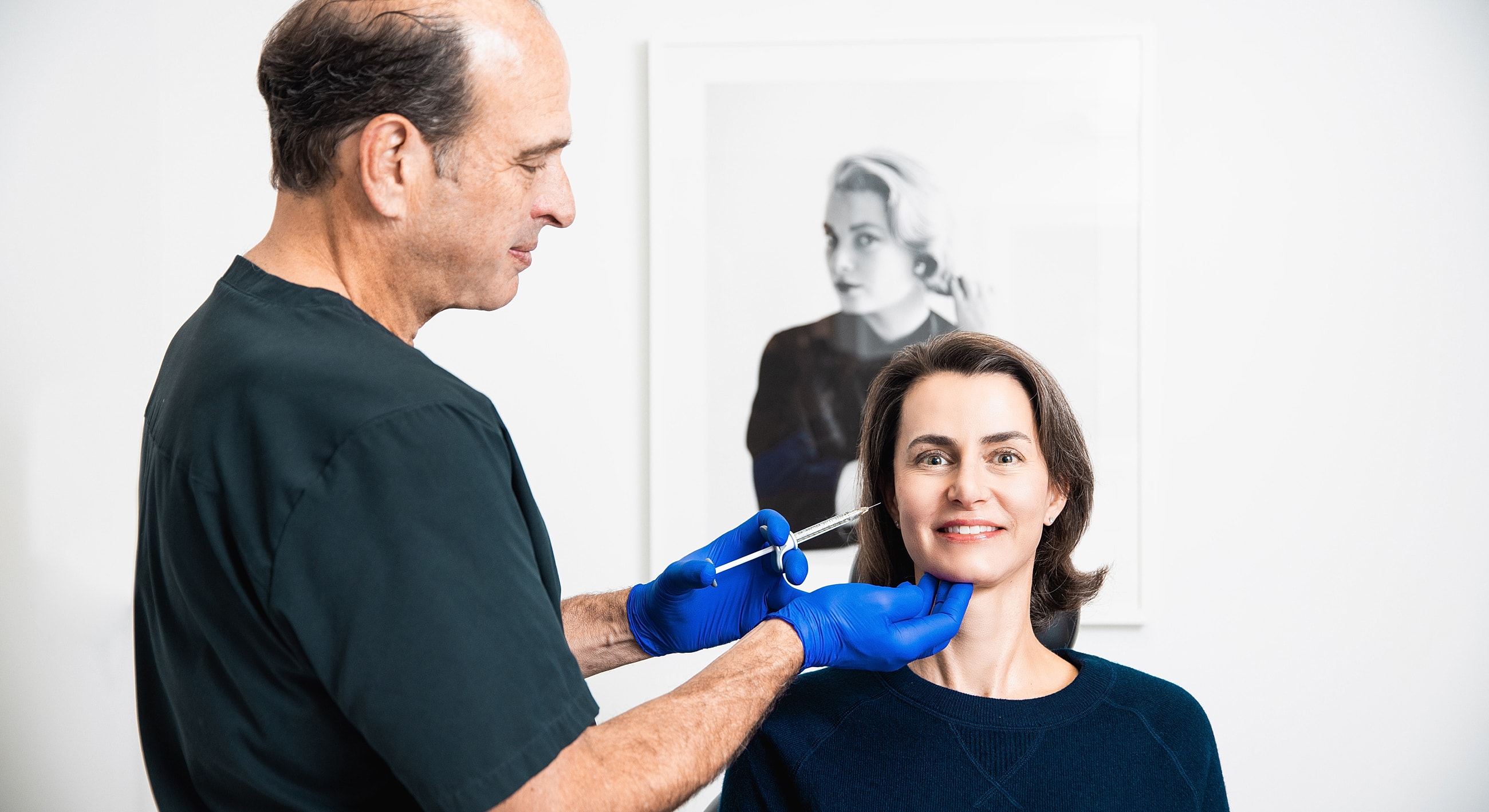 Cosmetic treatment session at a dental clinic.